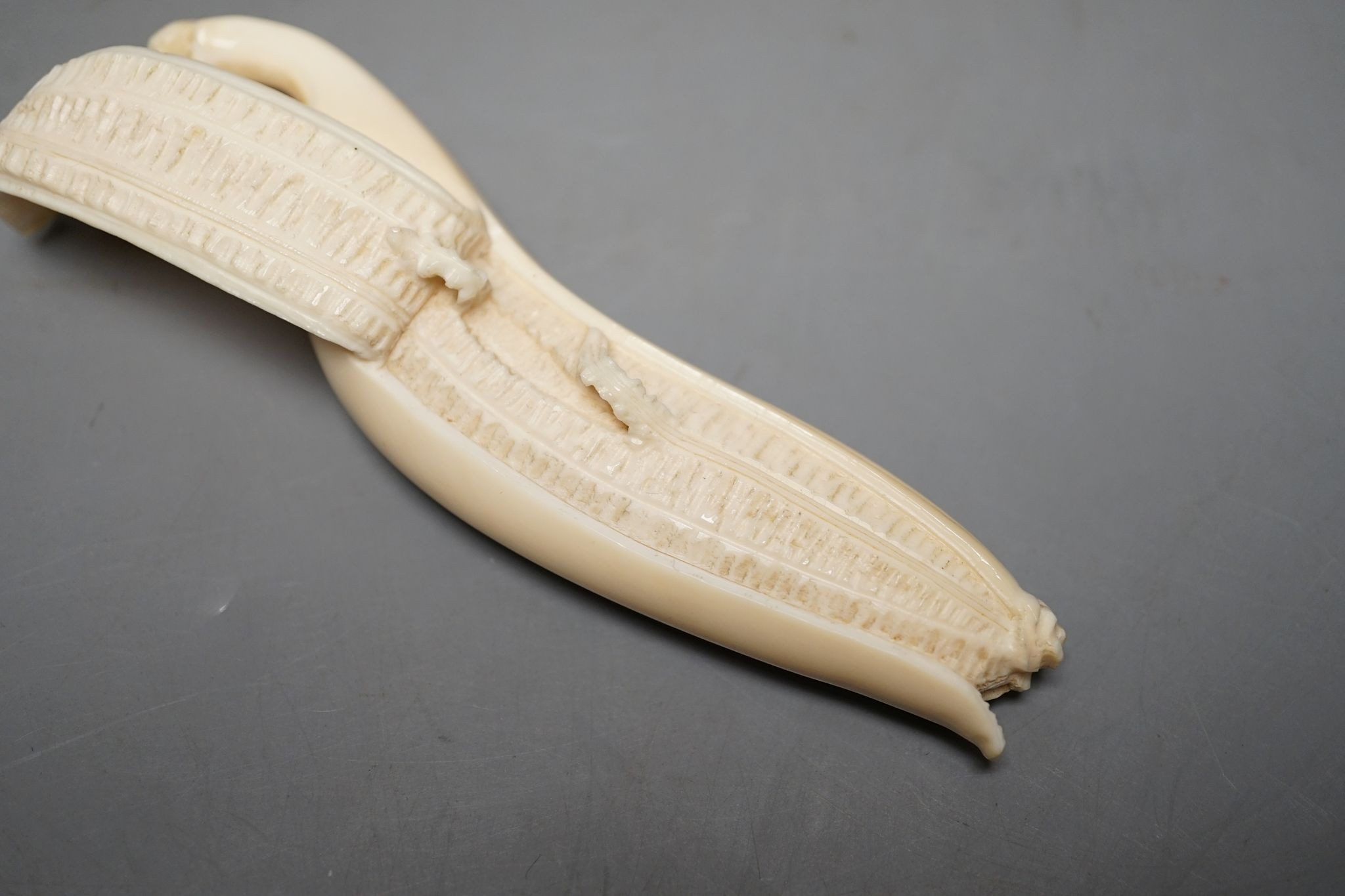 A Japanese ivory model of a banana, Meiji period 12cm